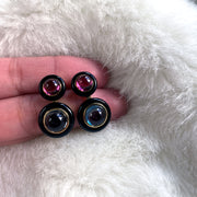 Garnet And London Blue Topaz Earrings with Onyx Ring Surround